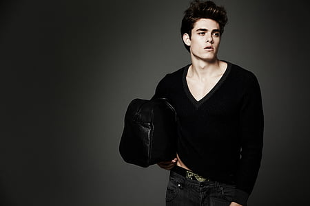man wearing black v-neck sweater thumbnail
