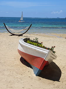 white and red boat near sea thumbnail