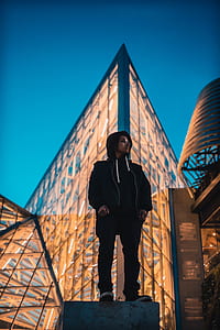 person standing on high-rise building thumbnail