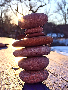 gray stones stack on brown wooden table thumbnail