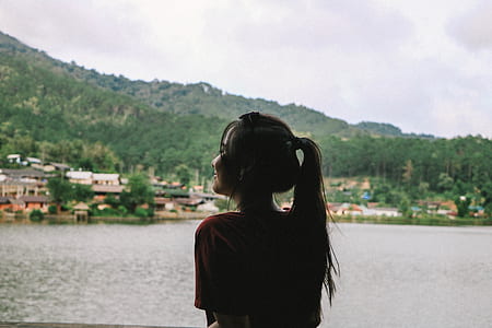 silhouette photo of woman with long black hair thumbnail