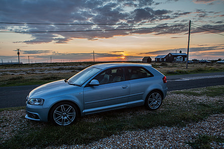 An Audi A3 S-Line sits at sunset on the Kent Coast in the South of England.  thumbnail