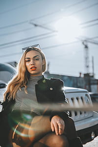 woman in front of Jeep Patriot SUV posing for photo shoot thumbnail