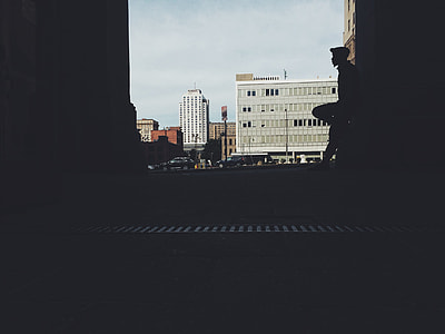 person leaning on building during daytime photography thumbnail