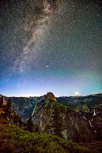 brown mountain under Milky Way Galaxy at night thumbnail