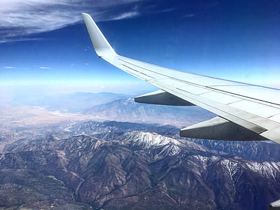 white wing plane in midair thumbnail