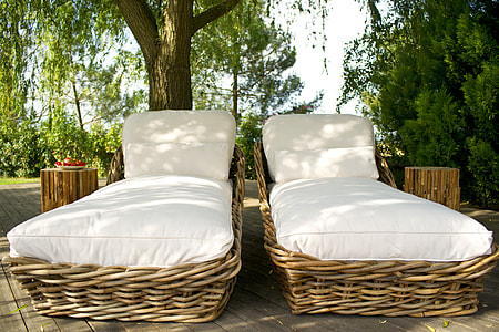 two brown wicker lounge chairs thumbnail