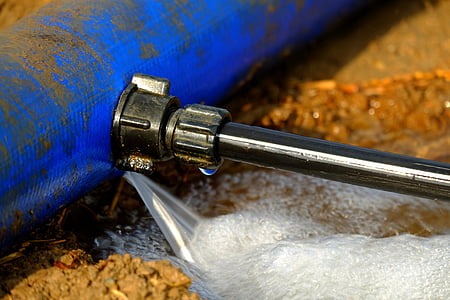 black pipe with coupling near blue pipe thumbnail
