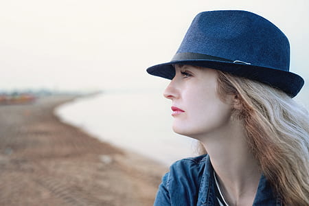 portrait photography of woman in black fedora hat posing for photo thumbnail