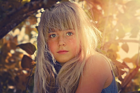 girl in blue sleeveless top during daytime thumbnail