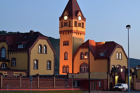 orange and brown chapel under blue sky thumbnail