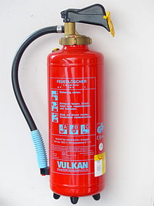 red Vulkan fire extinguisher on white wall thumbnail