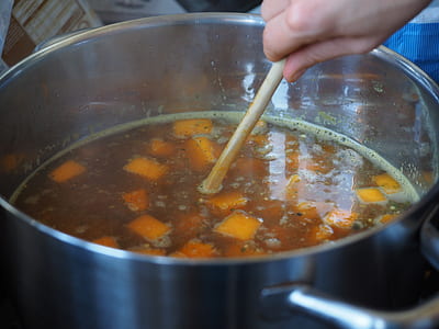 person about to stirring cook pot thumbnail