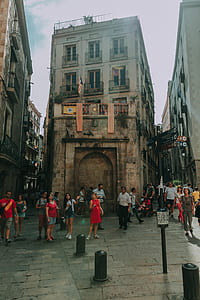 Photography of Group of People Standing Near Brown Concrete Building thumbnail