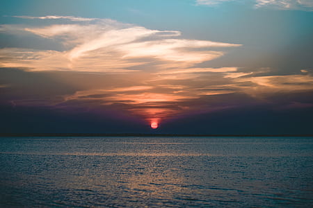 blue sea under green sky thumbnail