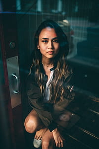 woman sitting near door thumbnail