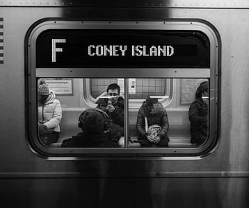 group of people sitting inside train thumbnail