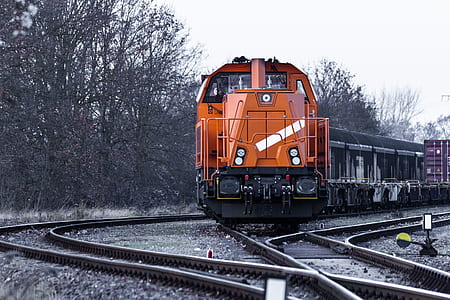 orange train during daytime thumbnail