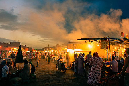 group of people in marketplace during nighttime thumbnail