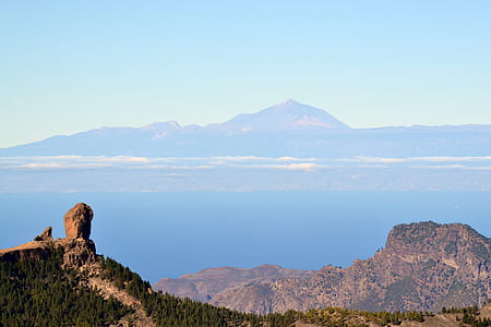 bird's-eye view of mountain beside ocean thumbnail