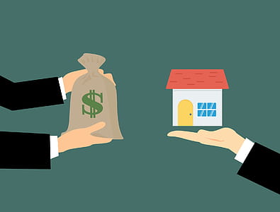 Real estate transaction with a realtor. Money changes hands for property. thumbnail