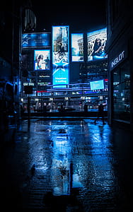 Person Walking Near Building during Nighttime thumbnail