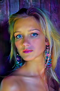 woman wearing earrings close-up photo thumbnail