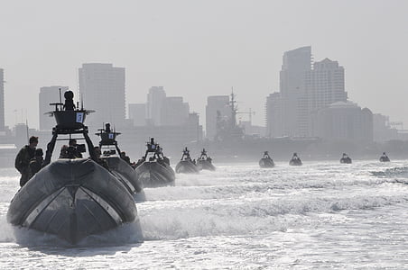 men riding power boat thumbnail