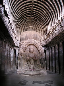 brown concrete buddha statue inside building thumbnail