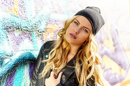 Woman Wearing Black Leather Jacket and Black Knit Cap thumbnail