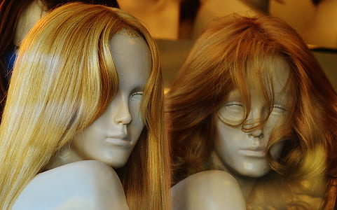 two mannequins with orange hair thumbnail