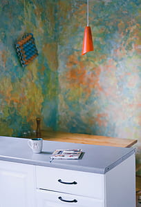 red pendant lamp above grey and white dresser inside room thumbnail
