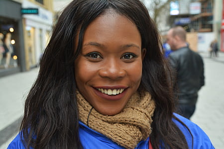 shallow focus photography of woman in brown knitted scarf thumbnail