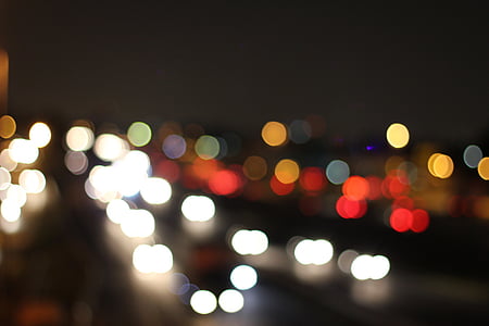 bokeh photography of road at night thumbnail