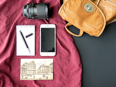 silver iPhone 6 beside brown leather bag thumbnail