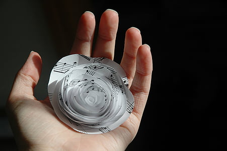 person holding paper flower thumbnail