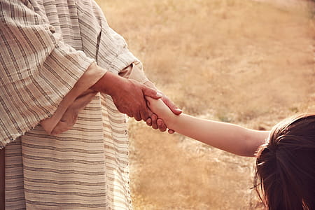Person Holding Kid Hand thumbnail