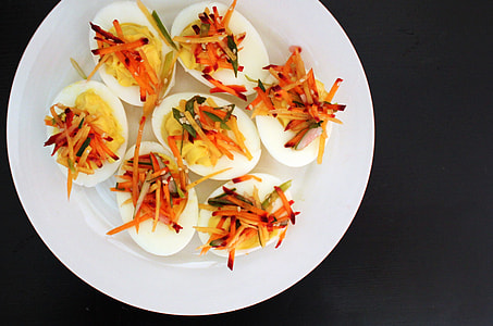 devil eggs on white plate thumbnail