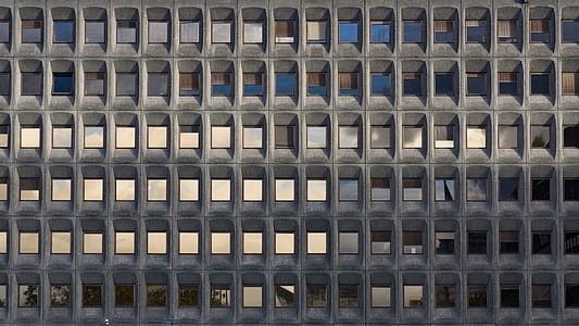 gray concrete framed glass building during day thumbnail