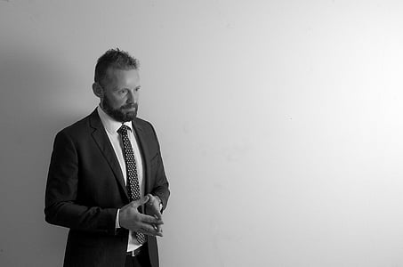 man standing near white surface thumbnail