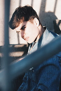 man in blue denim jacket looking fierce thumbnail