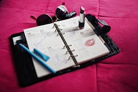 photo of black lipstick on white notebook thumbnail