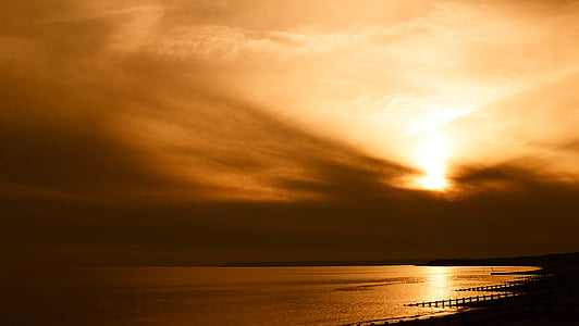 calm body of water during golden hour thumbnail