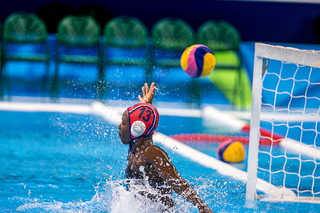 woman in pool raising right hand near white net thumbnail