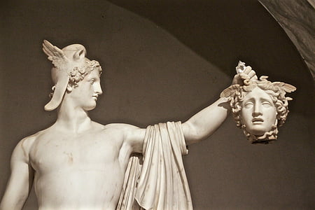 white concrete man holding head of woman statue thumbnail
