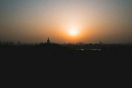 silhouette photography of city during sunset thumbnail