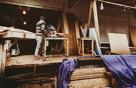 person standing beside table saw thumbnail