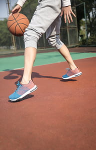 Person Dribbling Basketball thumbnail