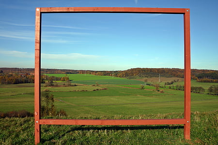 rectangular brown metal frame on green grass field thumbnail