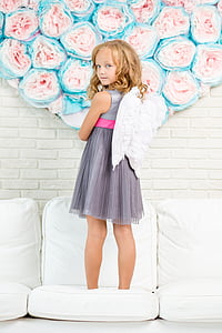 girl wearing gray sleeveless dress and white wing thumbnail